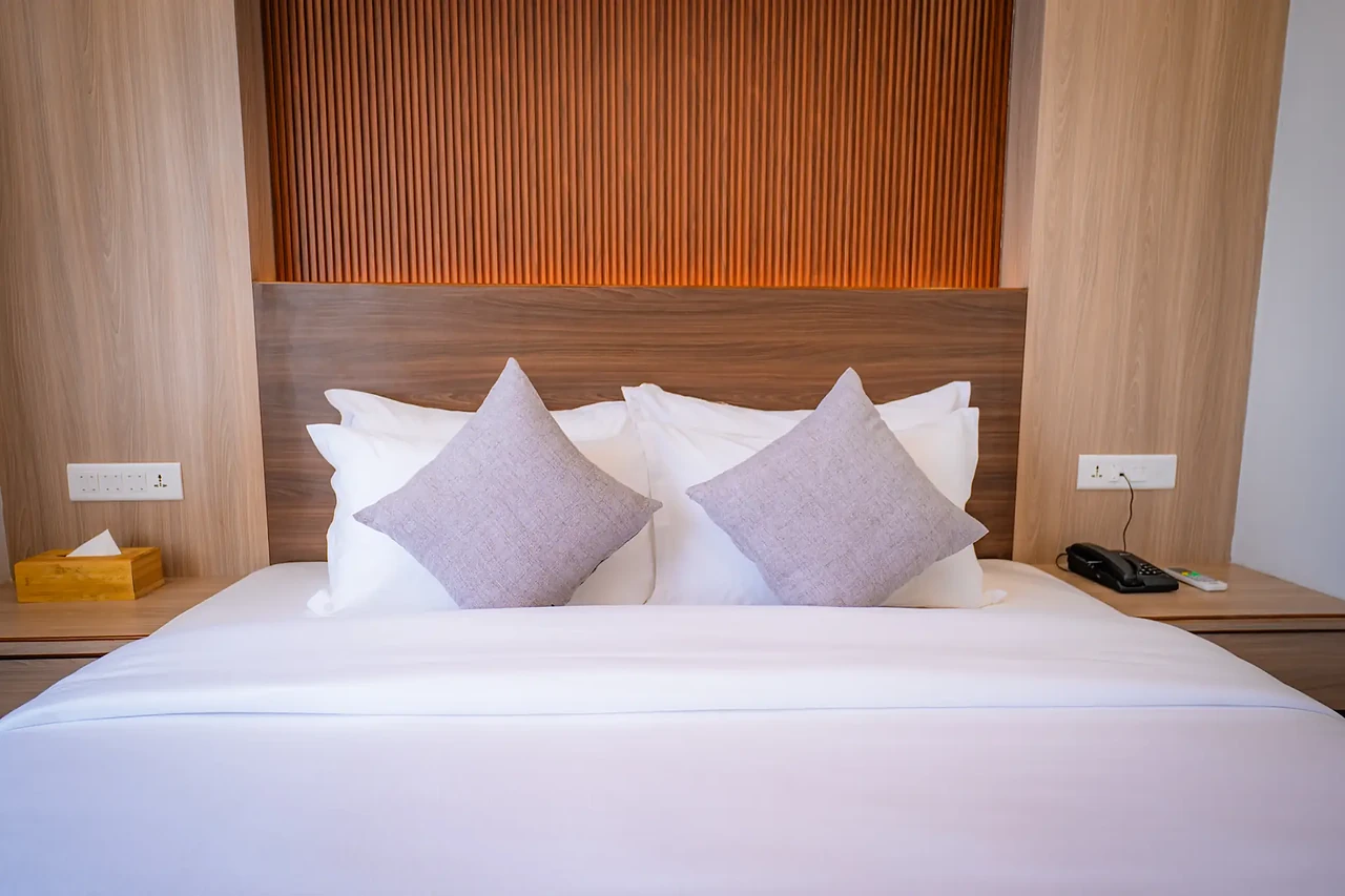Suite bed with soft pillows at Hotel Sampada