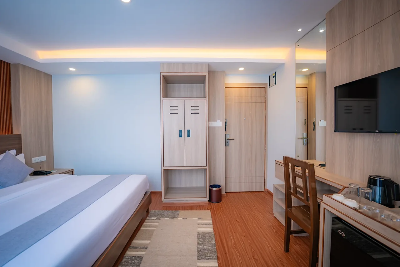 Deluxe Room seen toward the entry at Hotel Sampada